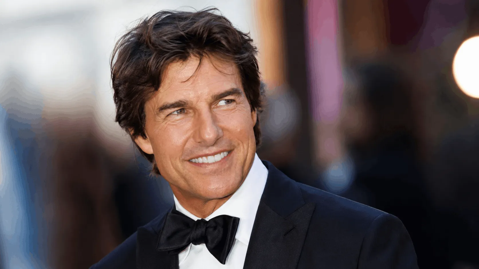 Tom Cruise net worth actor at a film premiere red carpet